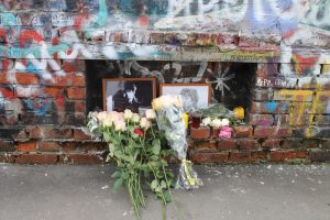 Tsoi Wall in Moscow, June 2017: framed pictures of Tsoi and flowers paying tribute to him